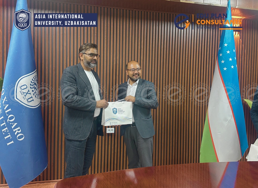 Receiving a special token of love and appreciation from Dr. Bhandari Kishan, Vice Dean of Asia International University, Bukhara (Uzbekistan) .